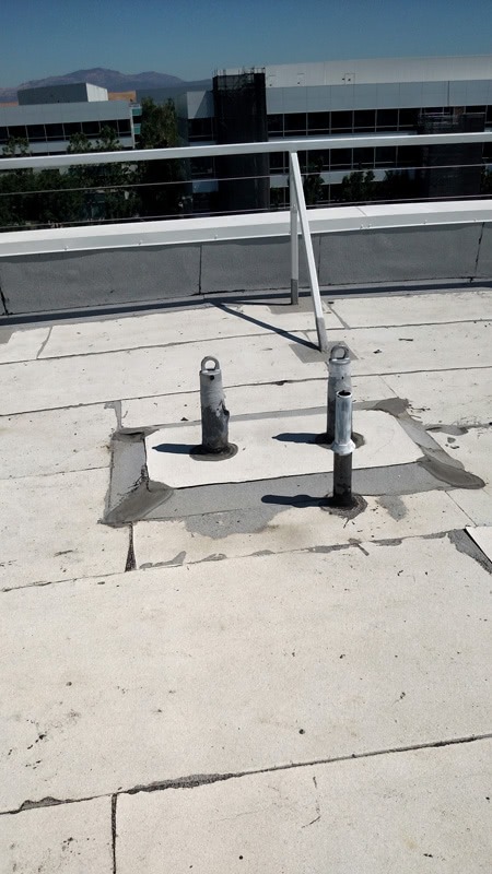 tie back anchor system with nearby roof davit