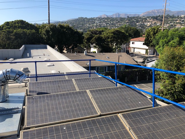 roof guardrail system near roof solar panels